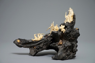 A Japanese carved ivory group on rootwood base, prob. Tokyo school, Meiji, 19th C.