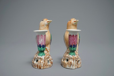 A pair of Chinese famille rose candle holders shaped as birds on a rock, Jiaqing