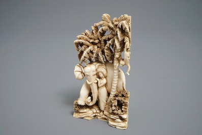 A Chinese carved ivory group of a lady with an elephant, 1st half 20th C.