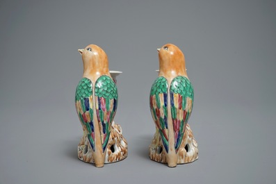 A pair of Chinese famille rose candle holders shaped as birds on a rock, Jiaqing