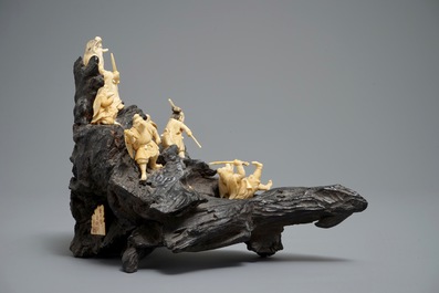 A Japanese carved ivory group on rootwood base, prob. Tokyo school, Meiji, 19th C.