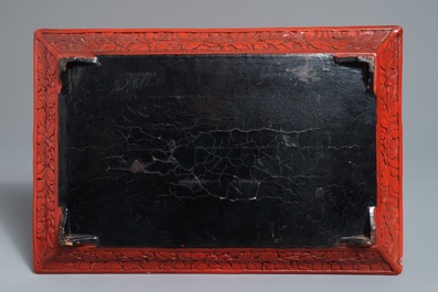A rectangular Chinese cinnabar lacquer tray with figures in a landscape, 18/19th C.
