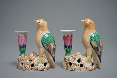 A pair of Chinese famille rose candle holders shaped as birds on a rock, Jiaqing