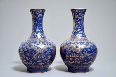 A pair of Chinese monochrome blue vases with gilt dragon design, 19th C.