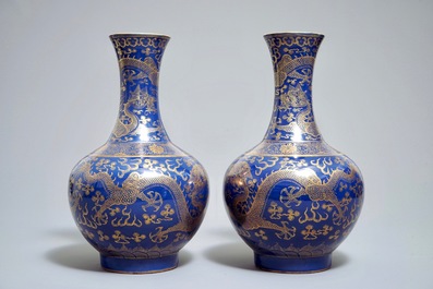 A pair of Chinese monochrome blue vases with gilt dragon design, 19th C.