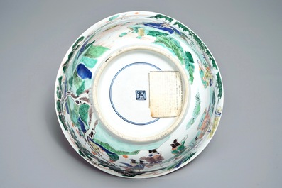 A large Chinese famille verte bowl with figures in a landscape, Kangxi
