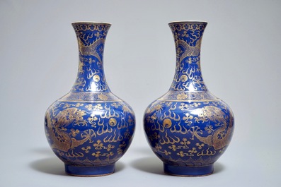 A pair of Chinese monochrome blue vases with gilt dragon design, 19th C.