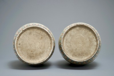 A pair of Chinese famille rose cream-ground butterfly vases, 19th C.