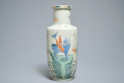 A Chinese famille rose rouleau vase with applied design of mythical beasts, Qianlong mark, 19th C.