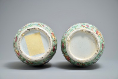 A pair of Chinese Canton famille rose celadon-ground vases, 19th C.