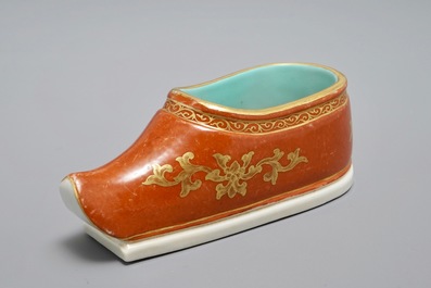 A Chinese coral-ground and gilt miniature shoe with hidden famille rose erotical design, 19/20th C.