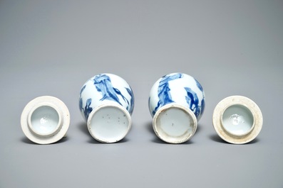 A pair of Chinese blue and white miniature vases and covers or tea caddies, Kangxi