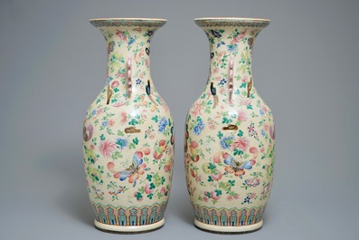 A pair of Chinese famille rose cream-ground butterfly vases, 19th C.