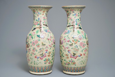 A pair of Chinese famille rose cream-ground butterfly vases, 19th C.