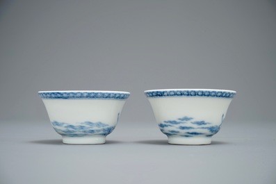 A pair of Chinese blue and white mythological cups and saucers depicting Neptune, Qianlong