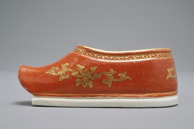 A Chinese coral-ground and gilt miniature shoe with hidden famille rose erotical design, 19/20th C.