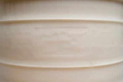 A Chinese cylindrical blanc de Chine Dehua censer on ruyi feet, 19/20th C.