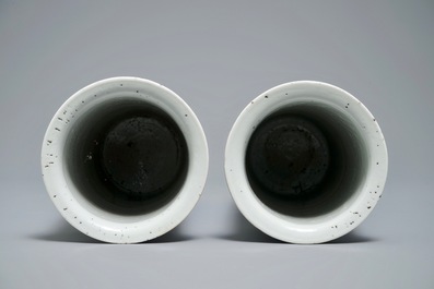 Two Chinese blue and white sleeve vases with ladies in a garden, 19th C.