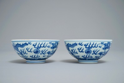 A pair of Chinese blue and white 'dragon' bowls, Guangxu mark, 19/20th C.