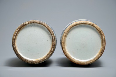 A pair of Chinese famille rose blue-ground vases, 19th C.
