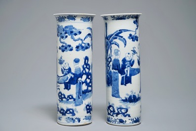 Two Chinese blue and white sleeve vases with ladies in a garden, 19th C.