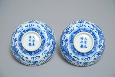 A pair of Chinese blue and white 'dragon' bowls, Guangxu mark, 19/20th C.