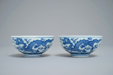 A pair of Chinese blue and white 'dragon' bowls, Guangxu mark, 19/20th C.