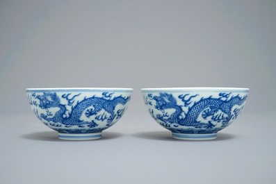 A pair of Chinese blue and white 'dragon' bowls, Guangxu mark, 19/20th C.