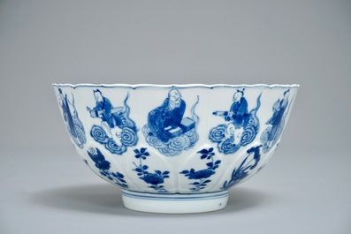 A Chinese blue and white moulded bowl with immortals, Chenghua mark, Kangxi