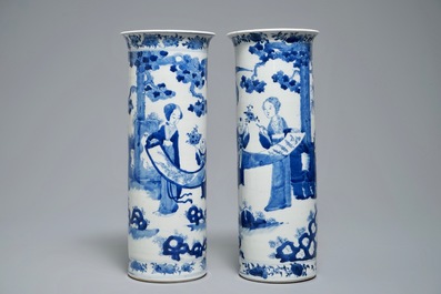 Two Chinese blue and white sleeve vases with ladies in a garden, 19th C.