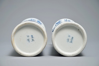 Two Chinese blue and white sleeve vases with ladies in a garden, 19th C.
