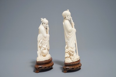 Two Chinese carved ivory figures of sages on wooden stands, 1st half 20th C.