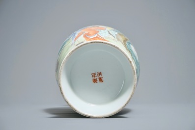 A Chinese famille rose vase with figures in a garden, Hongxian mark, 20th C.
