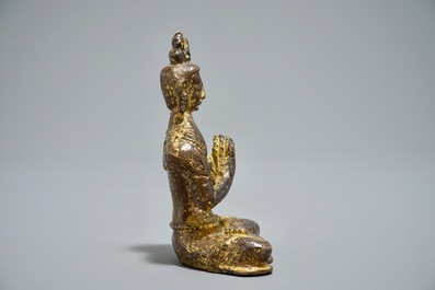 A Nepalese parcel-gilt bronze Buddha Namaskara, 16/17th C.