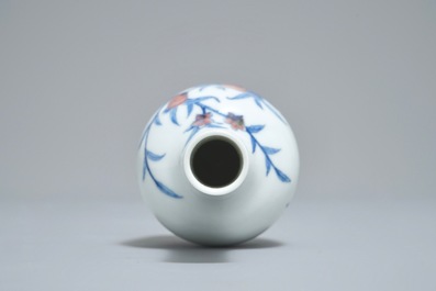 A Chinese blue and underglaze red 'sanduo' vase, Kangxi mark, 19/20th C.