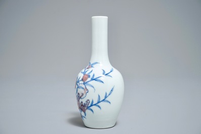 A Chinese blue and underglaze red 'sanduo' vase, Kangxi mark, 19/20th C.