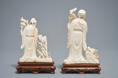 Two Chinese carved ivory figures of sages on wooden stands, 1st half 20th C.