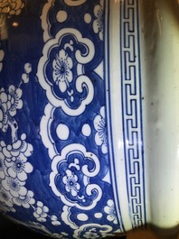 A Chinese blue and white fish bowl with design of prunus on cracked ice, 19th C.