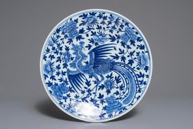 A Chinese blue and white 'phoenix' dish and an oval landscape dish, 19th C. and Qianlong
