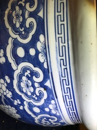 A Chinese blue and white fish bowl with design of prunus on cracked ice, 19th C.
