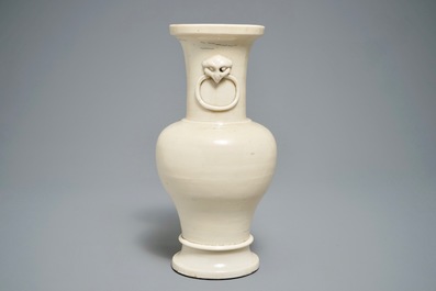 A Chinese monochrome cream-glazed vase and a tripod censer, Ming