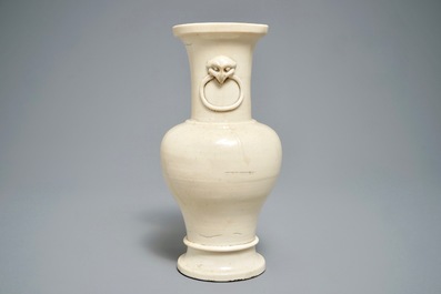 A Chinese monochrome cream-glazed vase and a tripod censer, Ming