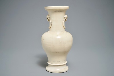 A Chinese monochrome cream-glazed vase and a tripod censer, Ming