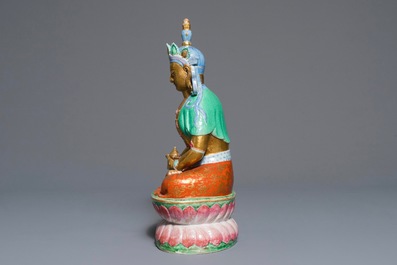 A Chinese parcel-gilt famille rose model of Buddha, 19th C.