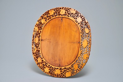 A finely carved Chinese wooden mirror frame, Canton, 19/20th C.