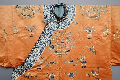 A Chinese orange-ground embroidered silk robe, 19th C.