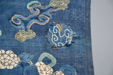 A Chinese blue-ground kesi eight-dragon robe, 19th C.
