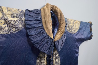 A blue-ground silk coat composed of Imperial Chinese gold thread dragon badges, 19th C.