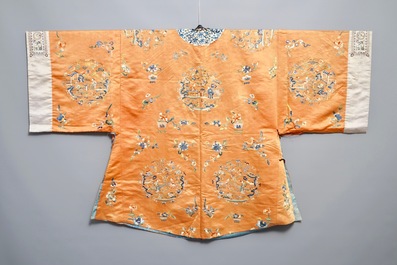 A Chinese orange-ground embroidered silk robe, 19th C.