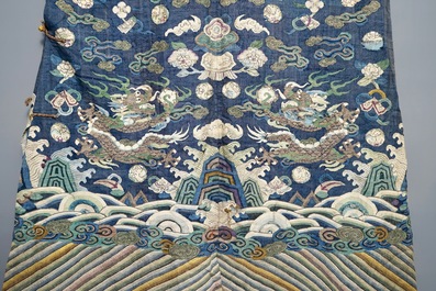 A Chinese blue-ground kesi eight-dragon robe, 19th C.